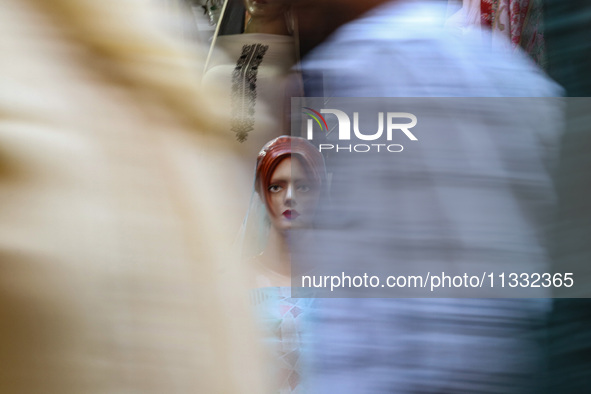 A mannequin is being decorated at a market ahead of the Eid al-Adha festival in Srinagar, India, on June 15, 2024. Eid al-Adha is the holies...