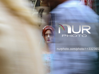 A mannequin is being decorated at a market ahead of the Eid al-Adha festival in Srinagar, India, on June 15, 2024. Eid al-Adha is the holies...