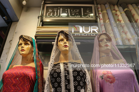 Mannequins are being decorated at a market ahead of the Eid al-Adha festival in Srinagar, India, on June 15, 2024. Eid al-Adha is the holies...