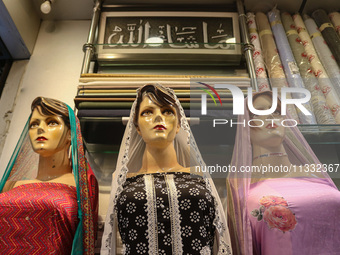 Mannequins are being decorated at a market ahead of the Eid al-Adha festival in Srinagar, India, on June 15, 2024. Eid al-Adha is the holies...