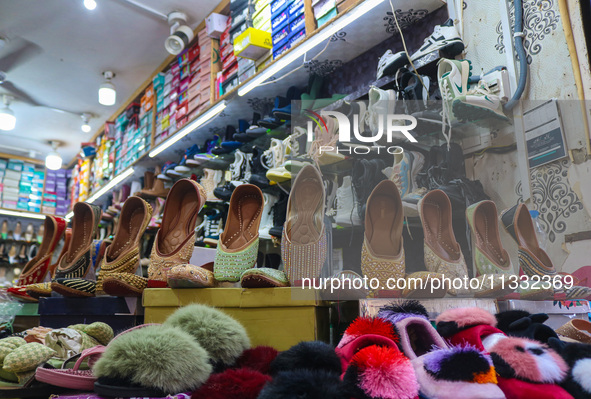 Footwear are being displayed at a market ahead of the Eid al-Adha festival in Srinagar, India, on June 15, 2024. Eid al-Adha is the holiest...