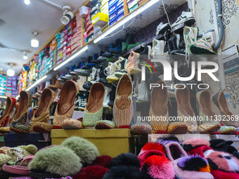 Footwear are being displayed at a market ahead of the Eid al-Adha festival in Srinagar, India, on June 15, 2024. Eid al-Adha is the holiest...