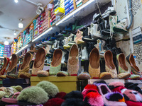 Footwear are being displayed at a market ahead of the Eid al-Adha festival in Srinagar, India, on June 15, 2024. Eid al-Adha is the holiest...