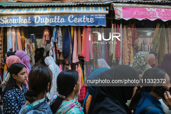 People are shopping at a market ahead of the Eid al-Adha festival in Srinagar, India, on June 15, 2024. Eid al-Adha is the holiest of the tw...