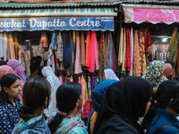 People are shopping at a market ahead of the Eid al-Adha festival in Srinagar, India, on June 15, 2024. Eid al-Adha is the holiest of the tw...