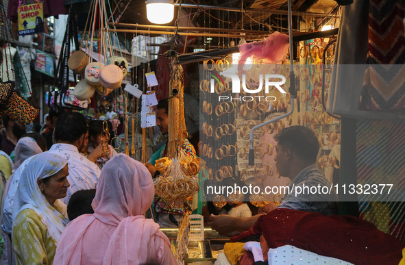 Women are shopping at a jewellery store ahead of the Eid al-Adha festival in Srinagar, India, on June 15, 2024. Eid al-Adha is the holiest o...