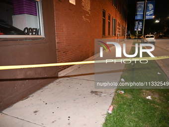 Two people are being shot while standing on the sidewalk in Chicago, Illinois, United States, on June 14, 2024. At approximately 11:50 p.m.,...