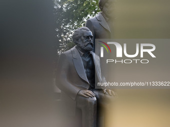 Karl Max is standing at the Marx and Engels monument in Berlin, Germany, on June 15, 2024. (