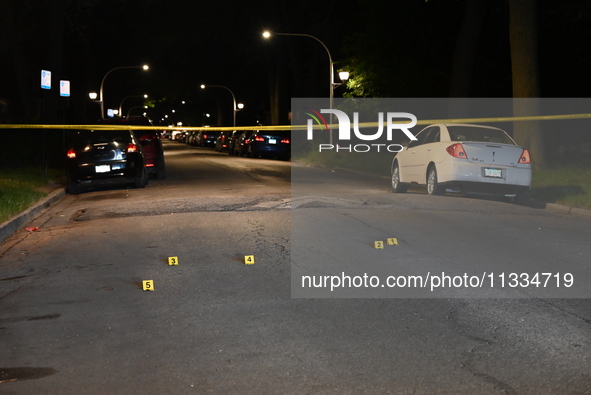 Evidence markers placed at the crime scene where shell casings were located as a Rideshare driver was shot and carjacked in Chicago, Illinoi...