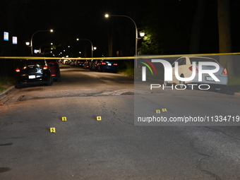 Evidence markers placed at the crime scene where shell casings were located as a Rideshare driver was shot and carjacked in Chicago, Illinoi...