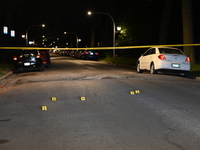 Evidence markers placed at the crime scene where shell casings were located as a Rideshare driver was shot and carjacked in Chicago, Illinoi...