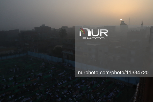 People gather at the club to perform Eid prayers in the village of Dondit, Dakahlia, June 16, 2024. 