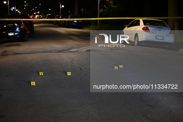 Evidence markers placed at the crime scene where shell casings were located as a Rideshare driver was shot and carjacked in Chicago, Illinoi...