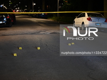 Evidence markers placed at the crime scene where shell casings were located as a Rideshare driver was shot and carjacked in Chicago, Illinoi...