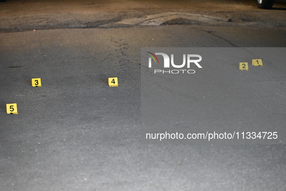 Evidence markers placed at the crime scene where shell casings were located as a Rideshare driver was shot and carjacked in Chicago, Illinoi...