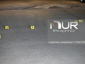 Evidence markers placed at the crime scene where shell casings were located as a Rideshare driver was shot and carjacked in Chicago, Illinoi...