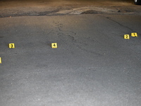 Evidence markers placed at the crime scene where shell casings were located as a Rideshare driver was shot and carjacked in Chicago, Illinoi...