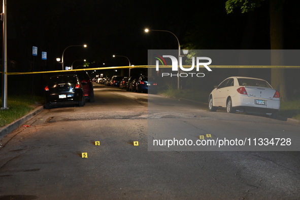 Evidence markers placed at the crime scene where shell casings were located as a Rideshare driver was shot and carjacked in Chicago, Illinoi...