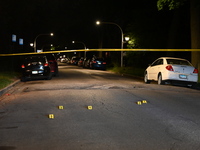 Evidence markers placed at the crime scene where shell casings were located as a Rideshare driver was shot and carjacked in Chicago, Illinoi...