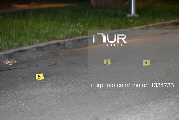 Evidence markers placed at the crime scene where shell casings were located as a Rideshare driver was shot and carjacked in Chicago, Illinoi...