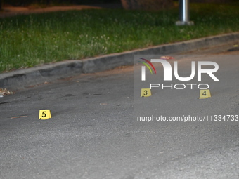 Evidence markers placed at the crime scene where shell casings were located as a Rideshare driver was shot and carjacked in Chicago, Illinoi...