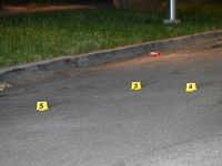 Evidence markers placed at the crime scene where shell casings were located as a Rideshare driver was shot and carjacked in Chicago, Illinoi...