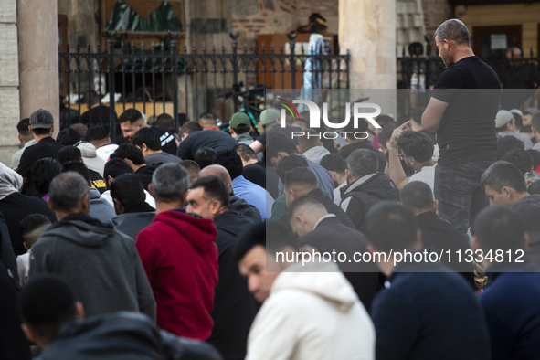 Muslims are praying in front of the Central Mosque of Sofia - Banya Bashi Mosque, marking and celebrating the holiday of Eid al Adha in Sofi...