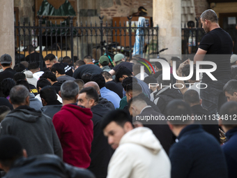 Muslims are praying in front of the Central Mosque of Sofia - Banya Bashi Mosque, marking and celebrating the holiday of Eid al Adha in Sofi...