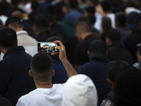 Muslims are praying in front of the Central Mosque of Sofia - Banya Bashi Mosque, marking and celebrating the holiday of Eid al Adha in Sofi...