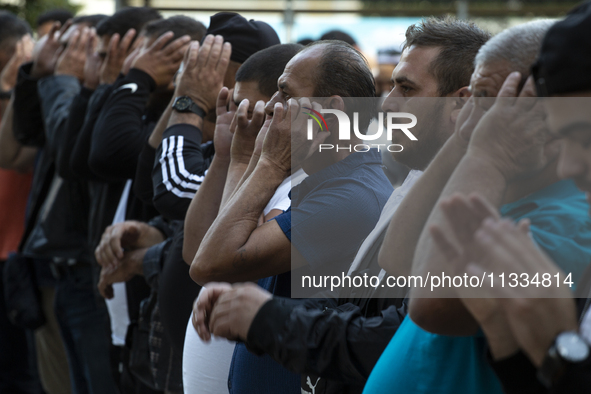 Muslims are praying in front of the Central Mosque of Sofia - Banya Bashi Mosque, marking and celebrating the holiday of Eid al Adha in Sofi...