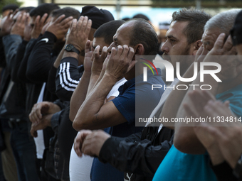 Muslims are praying in front of the Central Mosque of Sofia - Banya Bashi Mosque, marking and celebrating the holiday of Eid al Adha in Sofi...