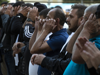 Muslims are praying in front of the Central Mosque of Sofia - Banya Bashi Mosque, marking and celebrating the holiday of Eid al Adha in Sofi...