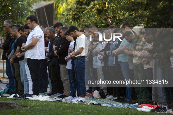 Muslims are praying in front of the Central Mosque of Sofia - Banya Bashi Mosque, marking and celebrating the holiday of Eid al Adha in Sofi...