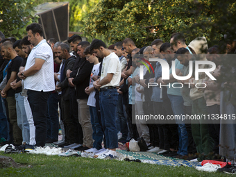 Muslims are praying in front of the Central Mosque of Sofia - Banya Bashi Mosque, marking and celebrating the holiday of Eid al Adha in Sofi...