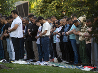 Muslims are praying in front of the Central Mosque of Sofia - Banya Bashi Mosque, marking and celebrating the holiday of Eid al Adha in Sofi...