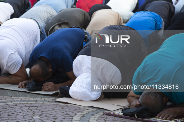 Muslims are praying in front of the Central Mosque of Sofia - Banya Bashi Mosque, marking and celebrating the holiday of Eid al Adha in Sofi...