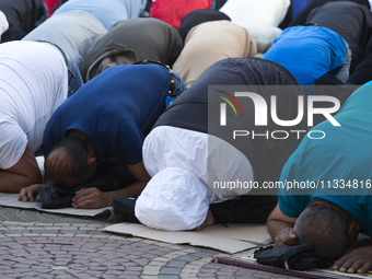 Muslims are praying in front of the Central Mosque of Sofia - Banya Bashi Mosque, marking and celebrating the holiday of Eid al Adha in Sofi...