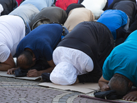 Muslims are praying in front of the Central Mosque of Sofia - Banya Bashi Mosque, marking and celebrating the holiday of Eid al Adha in Sofi...