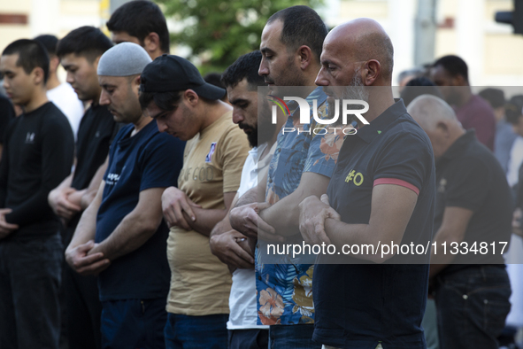 Muslims are praying in front of the Central Mosque of Sofia - Banya Bashi Mosque, marking and celebrating the holiday of Eid al Adha in Sofi...