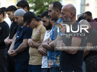 Muslims are praying in front of the Central Mosque of Sofia - Banya Bashi Mosque, marking and celebrating the holiday of Eid al Adha in Sofi...