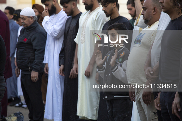 Muslims are praying in front of the Central Mosque of Sofia - Banya Bashi Mosque, marking and celebrating the holiday of Eid al Adha in Sofi...