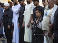 Muslims are praying in front of the Central Mosque of Sofia - Banya Bashi Mosque, marking and celebrating the holiday of Eid al Adha in Sofi...