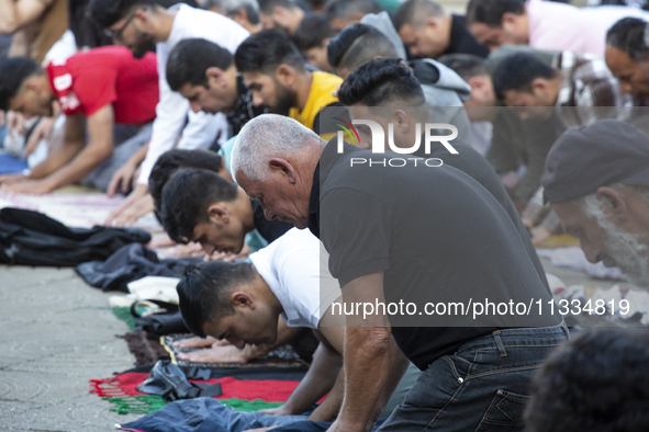 Muslims are praying in front of the Central Mosque of Sofia - Banya Bashi Mosque, marking and celebrating the holiday of Eid al Adha in Sofi...