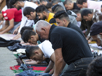 Muslims are praying in front of the Central Mosque of Sofia - Banya Bashi Mosque, marking and celebrating the holiday of Eid al Adha in Sofi...