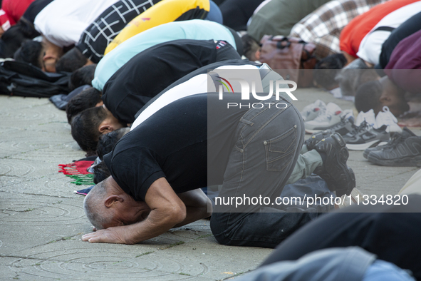 Muslims are praying in front of the Central Mosque of Sofia - Banya Bashi Mosque, marking and celebrating the holiday of Eid al Adha in Sofi...