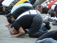 Muslims are praying in front of the Central Mosque of Sofia - Banya Bashi Mosque, marking and celebrating the holiday of Eid al Adha in Sofi...