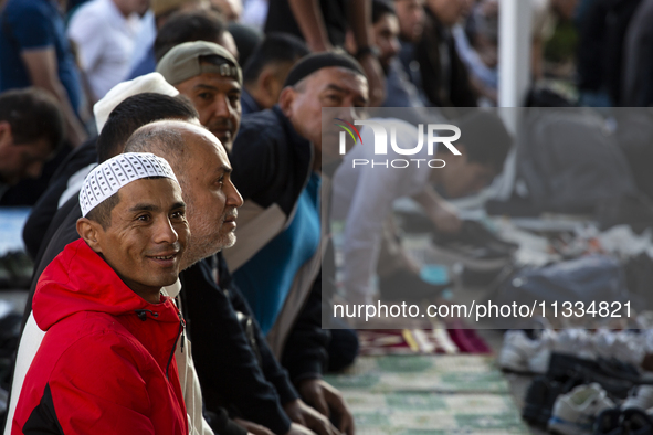 Muslims are praying in front of the Central Mosque of Sofia - Banya Bashi Mosque, marking and celebrating the holiday of Eid al Adha in Sofi...