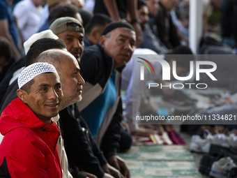 Muslims are praying in front of the Central Mosque of Sofia - Banya Bashi Mosque, marking and celebrating the holiday of Eid al Adha in Sofi...