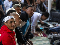 Muslims are praying in front of the Central Mosque of Sofia - Banya Bashi Mosque, marking and celebrating the holiday of Eid al Adha in Sofi...