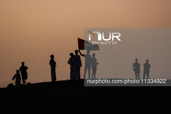 People are gathering to perform Eid prayers on one of the hills in the village of Abu Sir, in the middle of some of the ancient archaeologic...